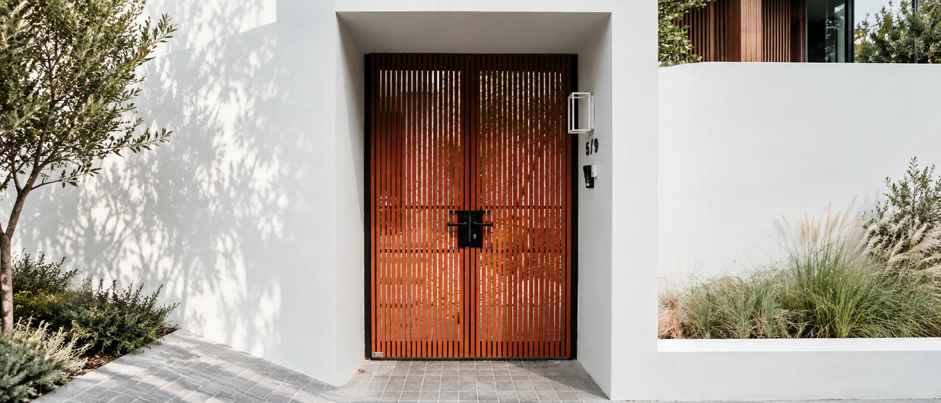 How should you design a front pedestrian gate, and which materials work best?
